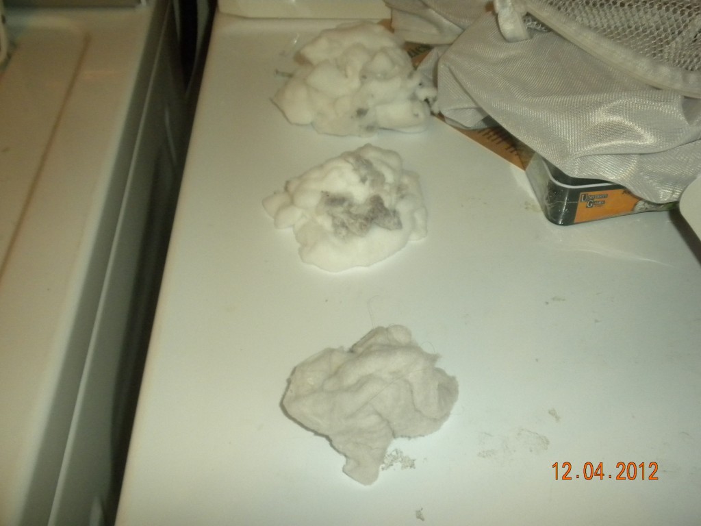 This is why you don't prep new cotton diapers with your regular diaper laundry-- all that fluff gets caught in 'velcro' tabs way too easily!