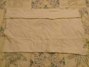 Fold a section of the diaper on opposite sides in to form front and back 'catchers'.