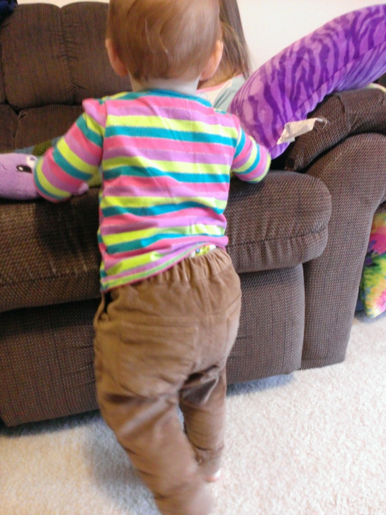 Buttoned loosely to show off cloth diaper